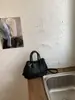 Bolso de Mano de Diseño de Moda de Nicho para Mujer 2026 Nuevo Estilo Coreano Bolso Cubo para Viajes Diarios Bolso de Hombro Único Cruzado Transfronterizo