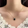 Collar de doble anillo con forma de corazón incrustado con diamantes de imitación, estilo cruzado de gran venta para mujer, cadena para clavícula de aleación ins, diseño de nicho, sentido de diseño, lujo ligero de nicho