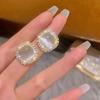 Pendientes pequeños retro con aguja de plata s925 y piedra de ojo de gato con diamantes de imitación, pendientes de gran sentido, nuevos pendientes de temperamento femenino 2023