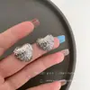 Pendientes de corazón de metal, ligeros, lujosos y de alta gama, para mujer. Diseño único, estilo moderno y sencillo en forma de corazón.