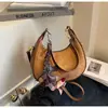 Bolso de axila tipo 'dumpling' de nicho francés de alta gama transfronterizo para mujer, nuevo bolso de mano de moda, bolso de hombro versátil de estilo extranjero