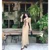 Vestido de Otoño 2026 Estilo Retro Francés de Lunares con Cuello en V y Cinta Otoño Adelgazante Temperamento Volante Falda Cola de Pez Manga Larga para Mujer