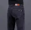 Hong Kong 2026 Outono Finos High-End Cinza Fumaça Masculinos Slim Fit Reta Business Stretch Jeans Casual