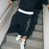 Calças de Verão 2025 Novas Street American Retro Hip-Hop Estampadas de Comprimento Médio Shorts de Cinco Pontos Casuais Largos Tendência para Homens