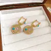 Aretes Redondos de Zirconia Bañados en Oro Real de 18K, Aretes Vintage de Nicho de Alta Gama con un Ambiente de Lujo Ligero
