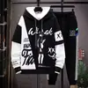 Sudadera con capucha de bloques de color y cordón, camiseta de manga larga de dos piezas de imitación para hombre, conjunto de nuevo estilo primavera/otoño 2026