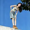 Shorts de mezclilla estilo americano salpicados de tinta para mujer, estilo fino de verano, nuevo modelo 2026, de cintura alta, corte holgado, adelgazantes, pierna ancha, de longitud media