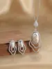 Conjunto de Geométrico Vazado de Luxo Leve Europeu e Americano Brincos Colar Onda Laser Oval Full Diamond Conjunto de Duas Peças Nova Tendência Transfronteiriça