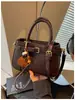 Bolso de mano pequeño, chic y minimalista de estilo coreano para mujer, nueva colección primavera 2026, bolso tipo cubo casual y apto para el trabajo, bolso cruzado de moda