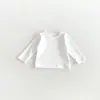 Nueva Camiseta Interior Básica para Niñas de Primavera y Otoño Moda Bebé Color Sólido Versátil Camiseta Estilo Coreano para Bebés Top de Cuello Redondo