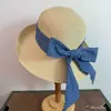 Sombrero de sol para mujer sombrero de paja ambiente de salida de vacaciones en la playa lunares lazo retro francés ala ancha hace que la cara se vea más pequeña moderno