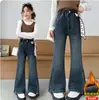 Calça jeans feminina primavera/outono 2026 novo estilo roupas infantis grandes primavera moda coreana calça boca de sino estilosa cross-border