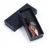 Venta al por mayor del fabricante Caja de embalaje exquisita para llaveros Papel rígido Esponja Rectangular Caja de papel para accesorios Suministro