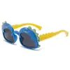 Gafas de sol infantiles Pequeño Dinosaurio al por mayor lindas de dibujos animados protección UV gafas infantiles gafas de juguete de bebé dinosaurio