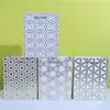 Bolsa de cartón blanco con dorado diario irregular en stock al por mayor embalaje circular bolsa de regalo suministro especial transfronterizo super