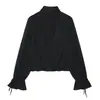 Moda de verano para mujer europea y americana, estilo nuevo, blusa semitransparente con cuello alto y mangas de farol plisadas decoradas con lazo