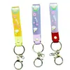 Llavero de accesorios de muñeca linda de cuerda de cuero de caucho suave pvc de arcoíris de deseo creativo accesorios de llavero para bolsa de pareja