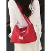 Bolso de lona casual de nicho, bolso de hombro de nailon, bolso cruzado deportivo, bolso de retazos versátil y elegante para el día a día