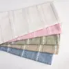 Suministro directo de fábrica al por mayor con diseño de cruz hueca cortina para sofá cojín para sofá mantel tela de poliéster simple y fresco