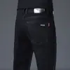 Jeans retro de alta gama para hombre, pantalones rectos de corte ajustado, pantalones versátiles elásticos de marca de moda, nuevo modelo primavera 2026