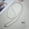 Correa de teléfono de perlas y diamantes para llevar cruzada, cadena de teléfono cruzada estilo diosa anti-pérdida, nueva correa de perlas de alta gama