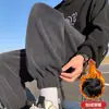 Calça de veludo cotelê masculina de corte solto para outono e inverno, calça de moletom versátil com forro de fleece, espessada e afunilada nos tornozelos, calça comprida casual da moda