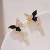 Pendientes de mariposa asimétricos con diseño único y sentido del nicho, pendientes colgantes de gota de agua súper brillantes de lujo y de alta gama, nuevos pendientes