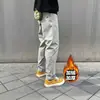 Pantalones de trabajo casuales para hombre de otoño e invierno, engrosados y forrados de polar, estilo recto holgado con pequeño logo triangular, diseño funcional, versátiles y modernos