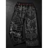 Y2K Ropa deportiva casual de tendencia europea y americana, comercio exterior transfronterizo, venta al por mayor, pantalones de chándal rectos holgados con estampado de camuflaje y retazos