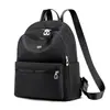 Mochila escolar de gran capacidad comercio exterior preferido mochila casual para mujer ligera color sólido tela Oxford bolsa de viaje para mujer