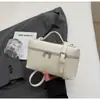 Bolsa de mão quadrada pequena de alta qualidade estilo coreano para mulheres, nova bolsa de ombro e transversal tipo caixa da moda casual 2026