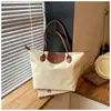 Bolso de mano para mujer estilo coreano 2026 modelo nuevo con diseño de color contrastante, moda de nicho bolso de hombro de gran capacidad