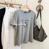 2026 Novo Estilo de Verão Estilo Coreano Solto Emagrecedor Versátil Gola Redonda Manga Curta Branca Estampa de Desenho Camiseta Top Feminino
