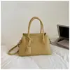 Al por mayor transfronterizo nuevo bolso de mujer de alta gama nicho bolso de mano bolso cubo moda simple para ir al trabajo de un solo hombro bandolera bolso de moda