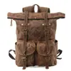 Mochila Retro de Lona Encerada al Aceite Europea y Americana para Hombre con Ribetes de Cuero Genuino Bolsillo Múltiple tipo Solapa Diseño de Pantalones Gran Capacidad Mochila de Viaje para Exteriores