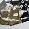 2026 Verano Nuevo Conjunto de Tres Piezas con Camisa de Trabajo de Manga Corta y Cuello Campana para Niños Conjunto de Shorts Deportivos para Bebé Venta al por Mayor