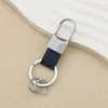 Llavero de Cuero Simple Personalizado Moda para Hombre Colgante de Cintura Llavero de Coche Almacenamiento en Casa Anti-pérdida Colgante con Hebilla en U