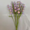 Venta al por mayor de fábrica rama de flor de lirio de cuatro cabezas tejida a mano para decoración de arreglo floral de sala de estar