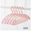 Con el mismo perchero de plástico ancho sin costuras para hombros, gancho para ropa antideslizante sólido engrosado, soporte para ropa semicircular giratorio al por mayor