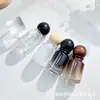 Botella de perfume redonda con forma de bola y diseño de montaña cilíndrica, botella con atomizador, botella vacía, en stock, empaque de fragancia, decantador de perfume, portátil