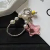 Estilo ins lindo cadena para teléfono con cuentas de perlas de estrella y hongo llavero amuleto para bolso venta al por mayor