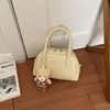 Bolso de mano de nicho súper caliente y elegante, bolso tipo bowling para mujer, nuevo bolso de moda 2026, bolso cruzado, bolso tote pequeño, bolso pequeño