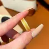 Tienda de oro con anillo de trigo de arena dorada imitación incrustado de circón anillo de dedo giratorio versátil recursos financieros anillo abierto para mujer estilo antiguo