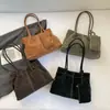 Bolso de mano tipo tote plisado de gran capacidad retro coreano para mujer 2026 Nuevo nicho de uso diario Bolso de hombro texturizado