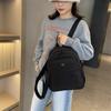 Mochila de color sólido para mujer, nueva mochila de tela de nailon ligera, de gran capacidad y de moda, mochila de viaje pequeña para mujer (2025)