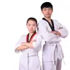 Venta al por mayor del fabricante de ropa de Taekwondo para adultos y niños, Uniformes de competición engrosados, Uniformes de entrenamiento de Taekwondo, Fábrica transfronteriza
