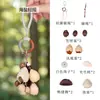 Estilo Mori Borla Natural Cáscara de Fruta Sonajero Colgante DIY Estilo Bohemio Retro Cuerda Colorida Carrillón de Viento Colgante para Bolsa Decoración de Coche