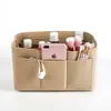 Bolsas de fieltro personalizables transfronterizas, incluyendo bolsas de tocador de fieltro y bolsas de almacenamiento multiusos, son artículos de gran venta para los mercados transfronterizos
