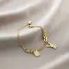 Pulsera de acero de titanio Jin Hui no se decolora cruzada popular femenina trébol de cinco hojas diamante estilo Ins personalidad chapado al vacío 18K