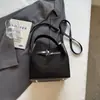 Bolso de mano retro transfronterizo para mujer, nuevo modelo otoño e invierno 2026, bolsa de hombro y cruzada versátil casual de gran capacidad